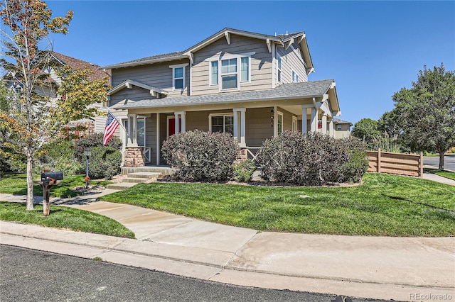 view of front of house with a porch and a front lawn