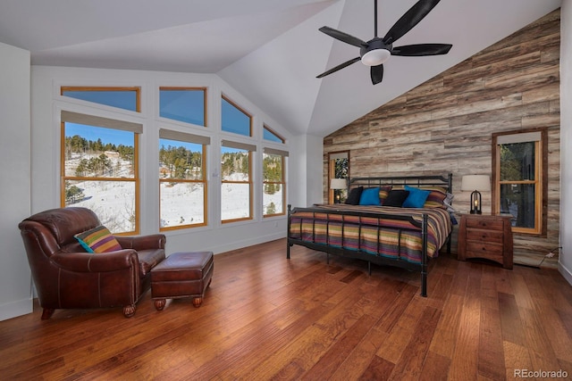 bedroom featuring high vaulted ceiling, wood-type flooring, baseboards, and a ceiling fan