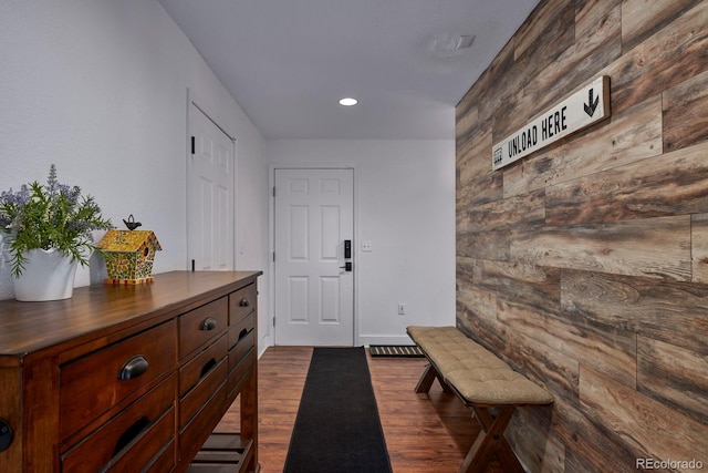 entryway with recessed lighting and dark wood-style flooring