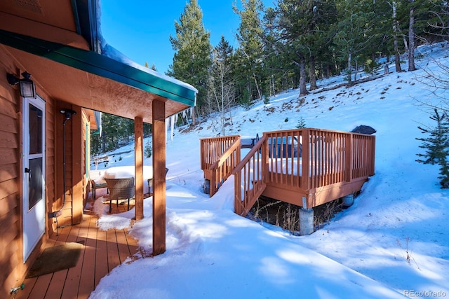 view of snow covered deck