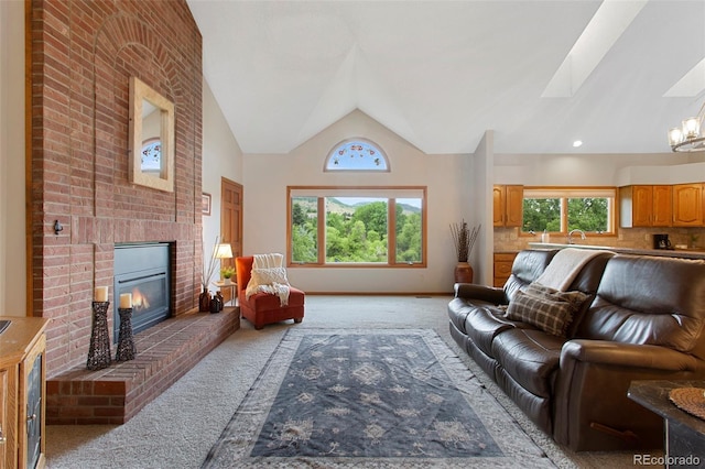 3 Silverberry, Littleton, CO 80127 - living area featuring light colored carpet, lofted ceiling, a fireplace, and a skylight