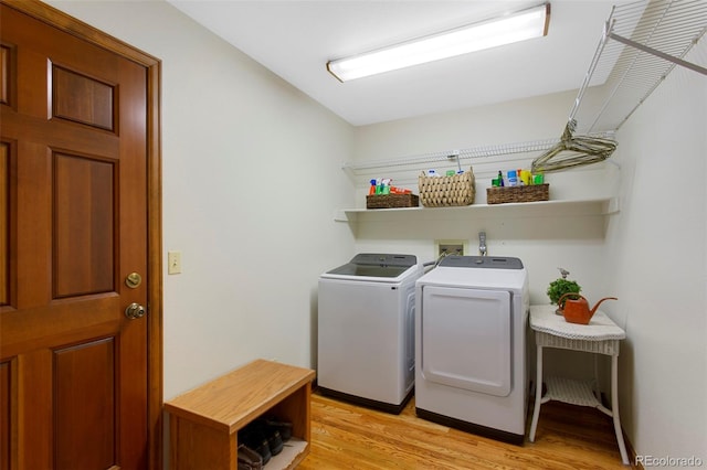 3 Silverberry, Littleton, CO 80127 - laundry room with washer and clothes dryer and light wood-style flooring