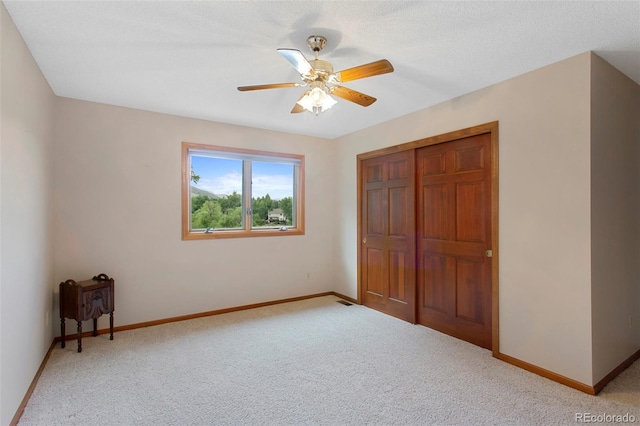 3 Silverberry, Littleton, CO 80127 - unfurnished bedroom with light carpet, a closet, and ceiling fan
