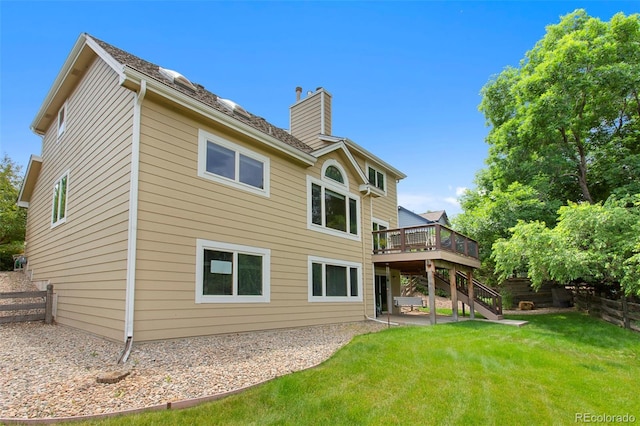 3 Silverberry, Littleton, CO 80127 - back of property featuring a chimney, stairs, and a wooden deck