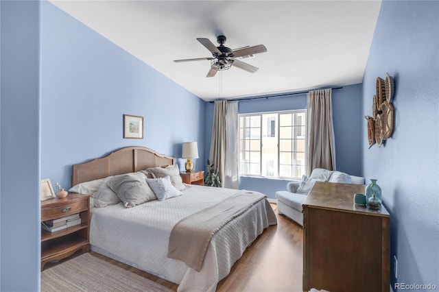 8405 Pebble Creek Way Unit 202, Highlands Ranch, CO 80126 - bedroom with wood finished floors and ceiling fan