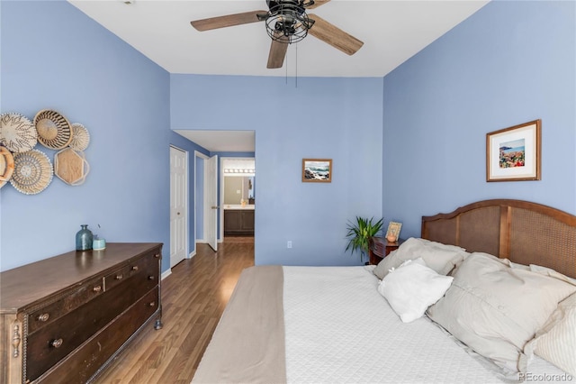 8405 Pebble Creek Way Unit 202, Highlands Ranch, CO 80126 - bedroom featuring wood finished floors, ensuite bathroom, baseboards, and a ceiling fan
