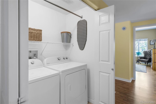 8405 Pebble Creek Way Unit 202, Highlands Ranch, CO 80126 - laundry area featuring independent washer and dryer, wood finished floors, and baseboards