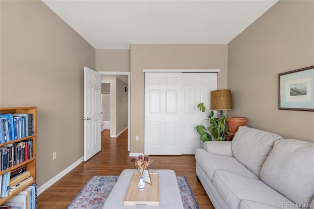 8405 Pebble Creek Way Unit 202, Highlands Ranch, CO 80126 - living area featuring wood finished floors and baseboards