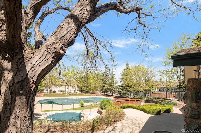 8405 Pebble Creek Way Unit 202, Highlands Ranch, CO 80126 - view of home's community with a putting green and fence