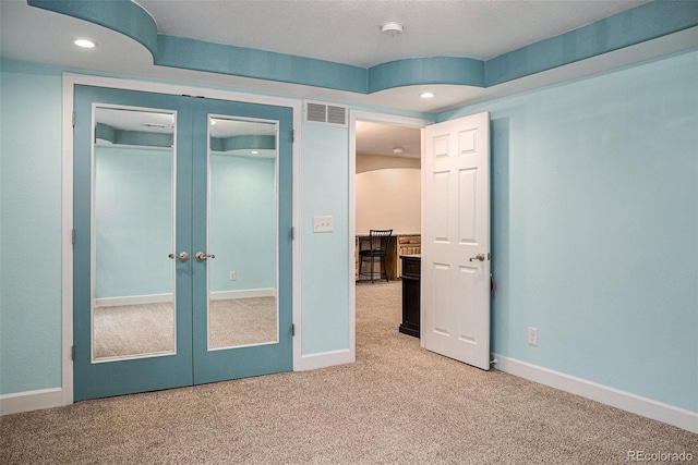 29751 E 163rd Pl, Brighton, CO 80603 - unfurnished bedroom with recessed lighting, light carpet, french doors, and visible vents