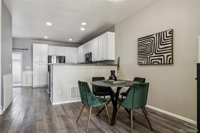15612 E 96th Way Unit 13E, Commerce City, CO 80022 - dining room with dark wood-style floors, baseboards, and recessed lighting