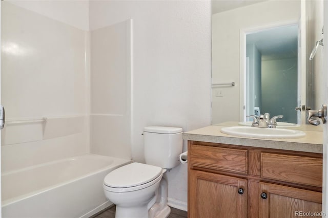 15612 E 96th Way Unit 13E, Commerce City, CO 80022 - full bathroom featuring toilet, vanity, baseboards, and  shower combination