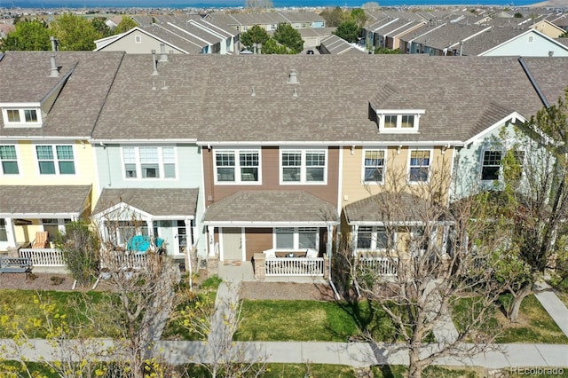 15612 E 96th Way Unit 13E, Commerce City, CO 80022 - back of house with a shingled roof, a residential view, and a patio area