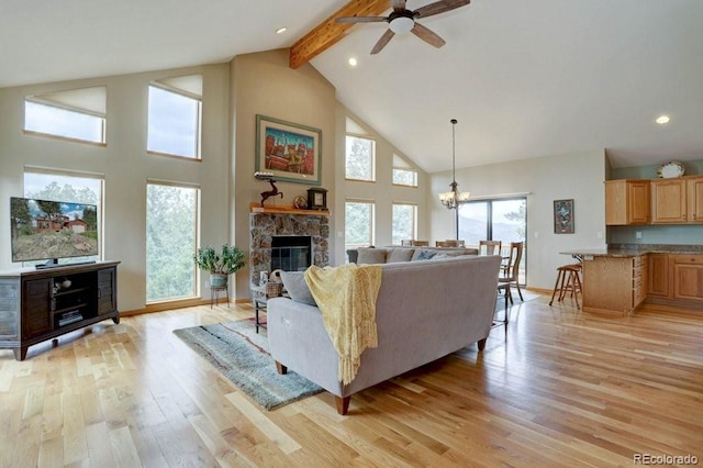 220 Long Ridge Dr, Bailey, CO 80421 - living room with high vaulted ceiling, ceiling fan, beam ceiling, light wood-style floors, and a chandelier