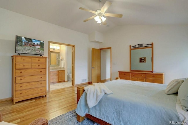 220 Long Ridge Dr, Bailey, CO 80421 - bedroom with light wood finished floors, lofted ceiling, ensuite bathroom, and ceiling fan