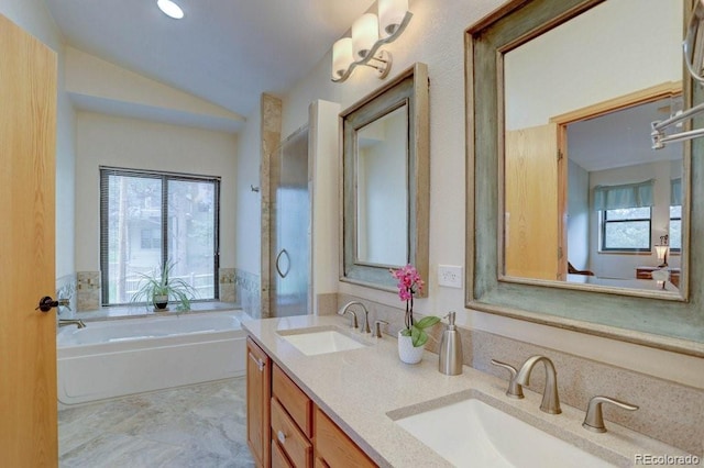 220 Long Ridge Dr, Bailey, CO 80421 - bathroom featuring a bath, double vanity, and vaulted ceiling