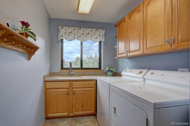 220 Long Ridge Dr, Bailey, CO 80421 - laundry area featuring independent washer and dryer, cabinet space, and light tile patterned flooring