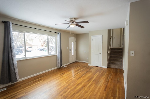 empty room featuring hardwood / wood-style flooring and ceiling fan