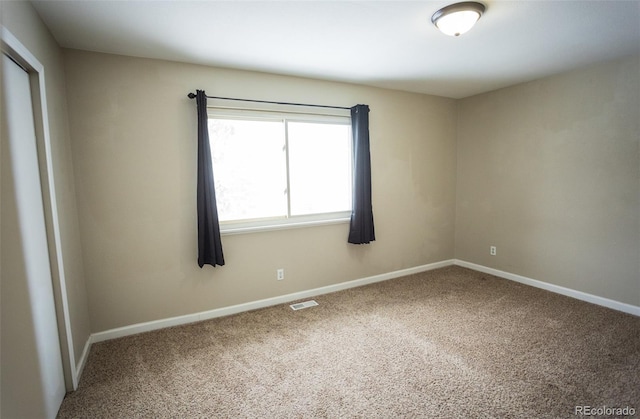 spare room with carpet floors