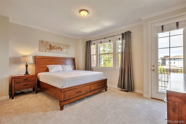 bedroom featuring multiple windows, light colored carpet, baseboards, and crown molding