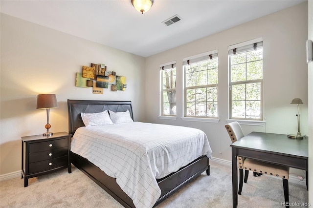 carpeted bedroom with baseboards