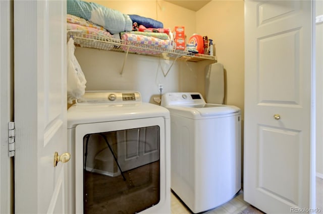 clothes washing area with laundry area and washing machine and clothes dryer