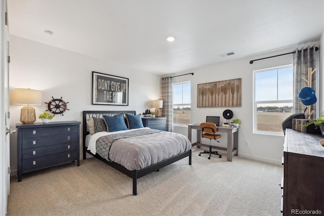 bedroom featuring light carpet