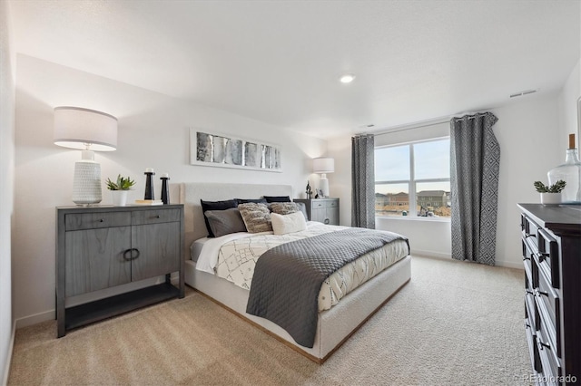 bedroom featuring light carpet