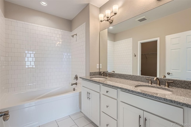 3573 S Lisbon Ct, Aurora, CO 80013 - bathroom with tile patterned flooring, tub / shower combination, and double vanity