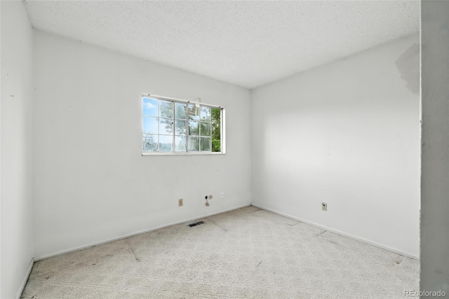 2527 S Ouray Way, Aurora, CO 80013 - carpeted empty room with baseboards and a textured ceiling