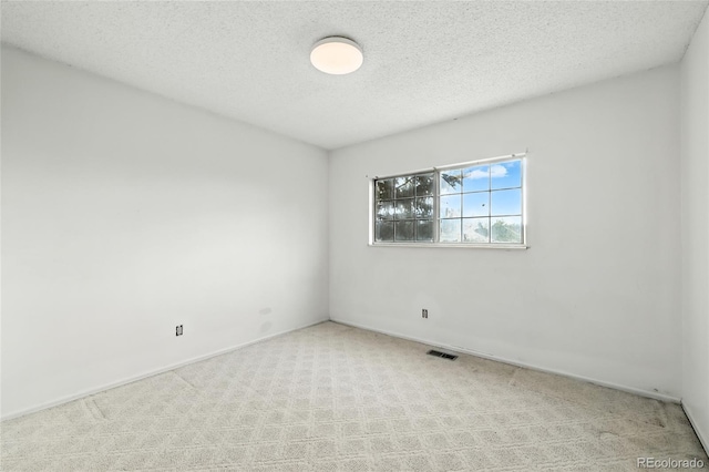 2527 S Ouray Way, Aurora, CO 80013 - spare room with a textured ceiling and carpet flooring