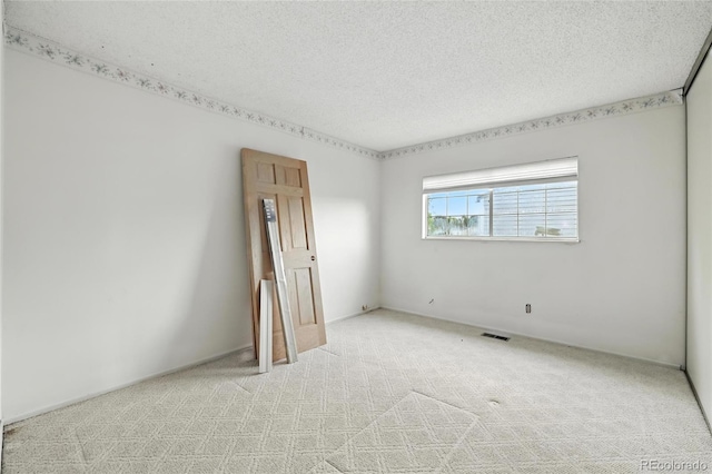 2527 S Ouray Way, Aurora, CO 80013 - unfurnished room with light colored carpet and a textured ceiling