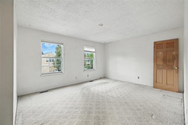 2527 S Ouray Way, Aurora, CO 80013 - carpeted empty room with a textured ceiling