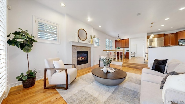 203 S Jackson St, Denver, CO 80209 - living room featuring light wood finished floors, recessed lighting, and a fireplace