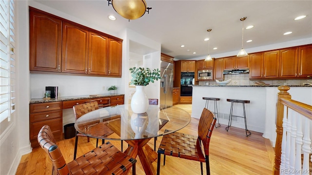 203 S Jackson St, Denver, CO 80209 - dining space with light wood-style flooring and recessed lighting