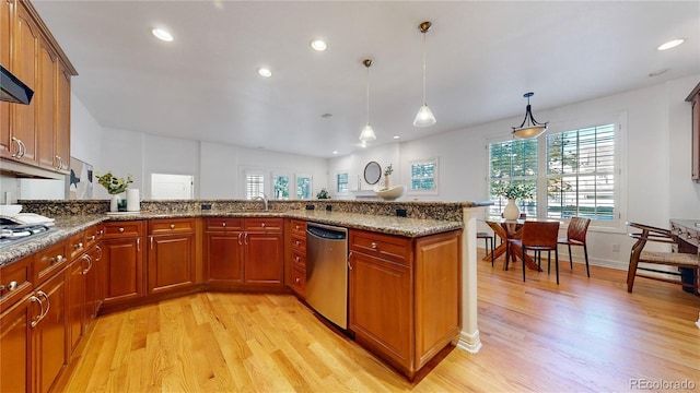 203 S Jackson St, Denver, CO 80209 - kitchen featuring appliances with stainless steel finishes, light wood-style flooring, healthy amount of natural light, and recessed lighting