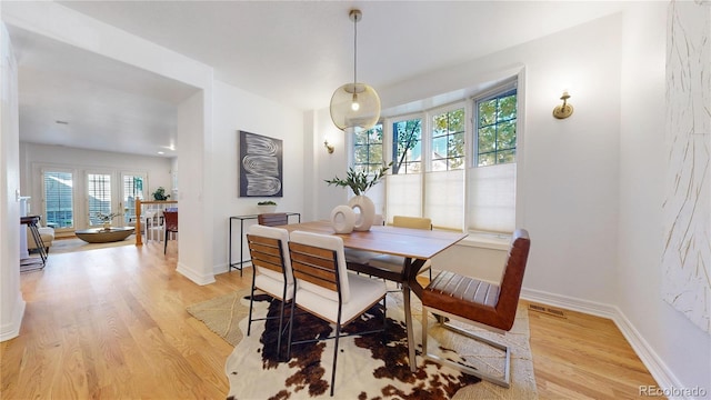 203 S Jackson St, Denver, CO 80209 - dining space featuring light wood-type flooring and baseboards