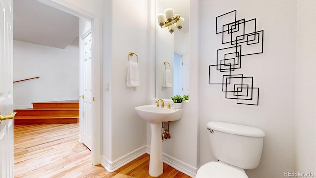 203 S Jackson St, Denver, CO 80209 - bathroom with toilet and wood finished floors