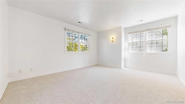 203 S Jackson St, Denver, CO 80209 - empty room featuring healthy amount of natural light and light carpet