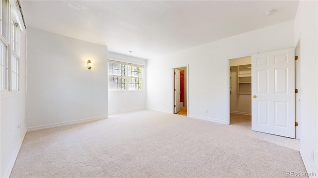 203 S Jackson St, Denver, CO 80209 - carpeted empty room featuring a smoke detector and baseboards