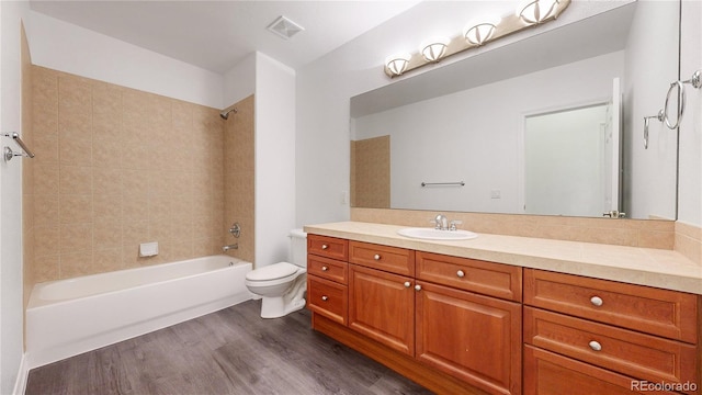 203 S Jackson St, Denver, CO 80209 - full bathroom featuring vanity, shower / washtub combination, and wood finished floors