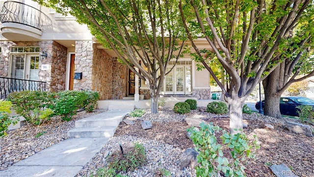 203 S Jackson St, Denver, CO 80209 - view of exterior entry with stone siding and french doors