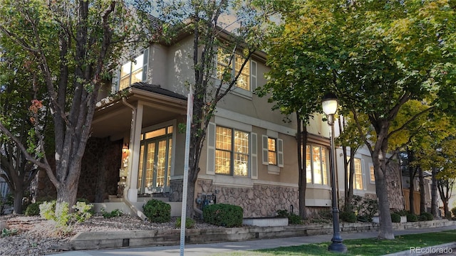 203 S Jackson St, Denver, CO 80209 - view of front of house featuring stone siding and stucco siding
