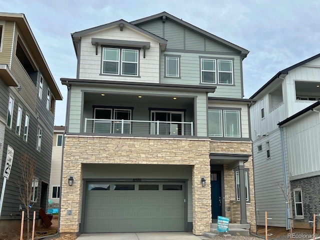 craftsman-style house with a balcony and a garage