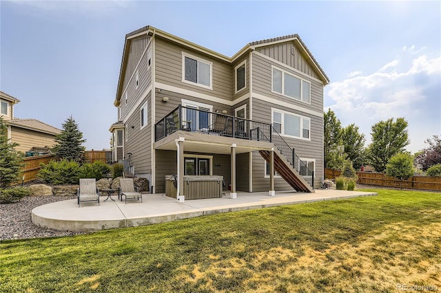 16059 E Grass River Pl, Parker, CO 80134 - back of property featuring a patio area, board and batten siding, stairs, and a deck