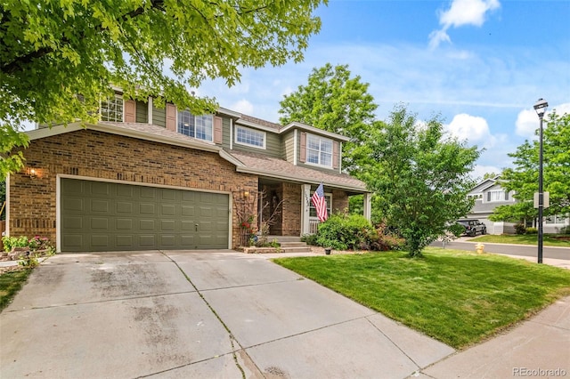 10284 Royal Eagle St, Highlands Ranch, CO 80129 - view of front facade with a front yard, driveway, brick siding, and an attached garage