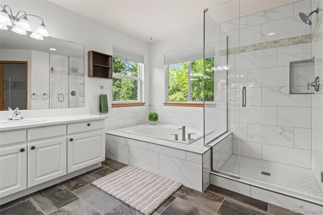 10284 Royal Eagle St, Highlands Ranch, CO 80129 - full bathroom featuring a garden tub, vanity, and a shower stall