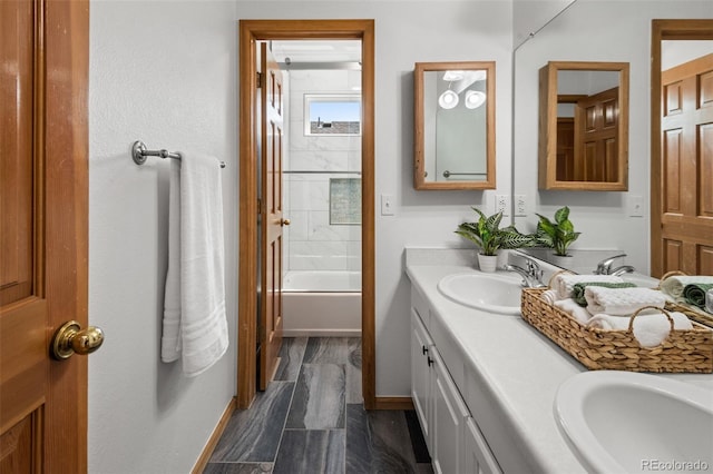 10284 Royal Eagle St, Highlands Ranch, CO 80129 - bathroom with double vanity, shower / washtub combination, and wood finished floors