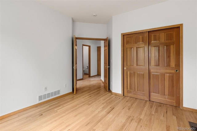 10284 Royal Eagle St, Highlands Ranch, CO 80129 - unfurnished bedroom with light wood-style flooring and a closet