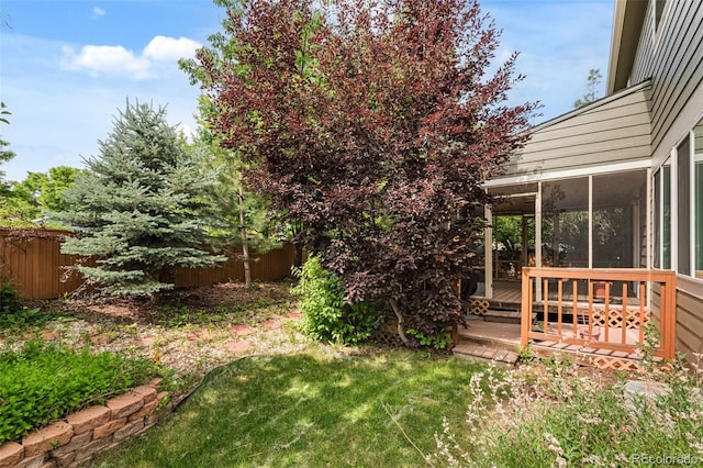 10284 Royal Eagle St, Highlands Ranch, CO 80129 - view of yard featuring a sunroom and a wooden deck